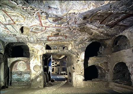 Interior of a catacomb chamber cut from tufa stone showing fragments of frescoed decoration à Anonyme