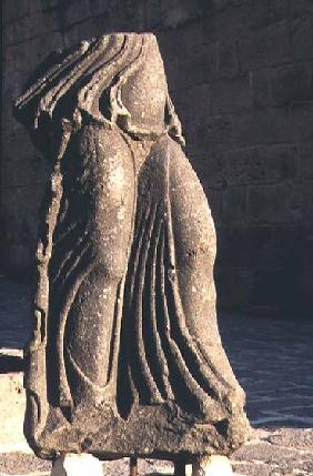 Fragment of a sculpture of a standing womanRoman