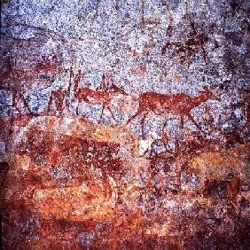 Rock painting with people and animals