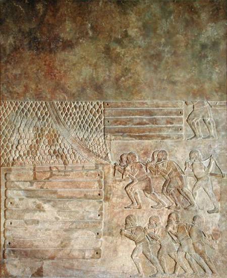 Relief depicting the stocking up of wood on the shore before transportation by sea, from the Palace à Assyrien