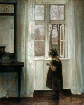 Petite fille à une fenêtre
