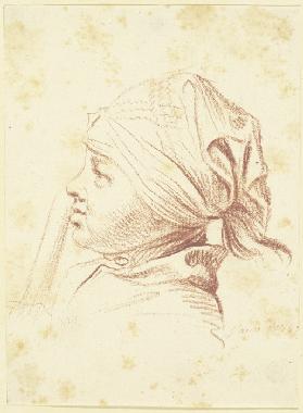Kopf eines jungen Mannes mit Kopftuch, einen Stab an den Mund haltend, im Profil nach