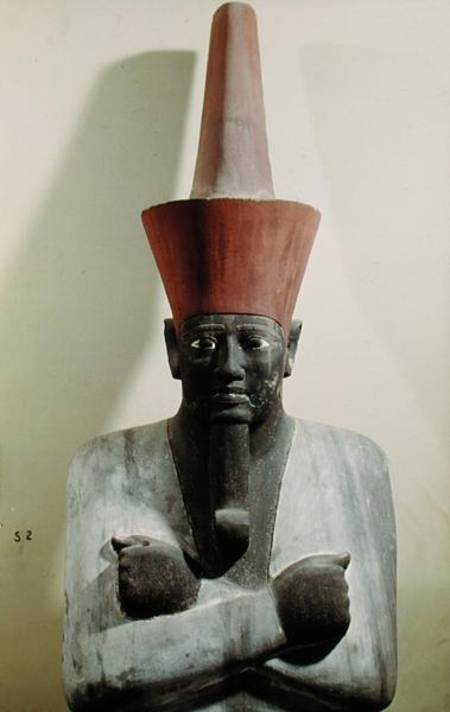 Detail of a statue of Mentuhotep II, enthroned and wearing the red crown of Lower Egypt, taken from à Egyptien