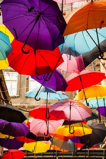 old building and decorative umbrellas