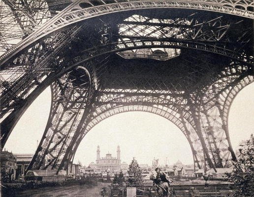 Under the Eiffel Tower, before ascending, from 'L'Album de l'Exposition 1889' by Glucq, Paris 1889 ( à Photographe français (19ème siècle)