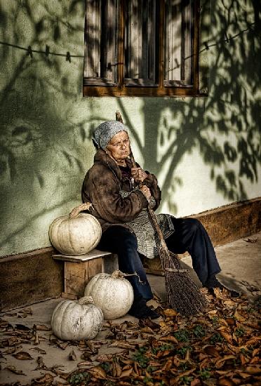 Old woman with pumpkins