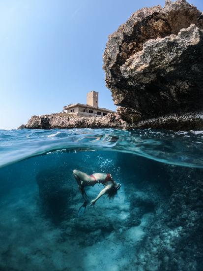 Laying under the island