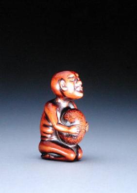 Netsuke of a blind masseur stone lifter