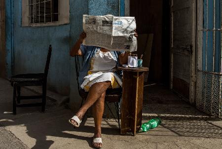 Hidden behind the newspaper