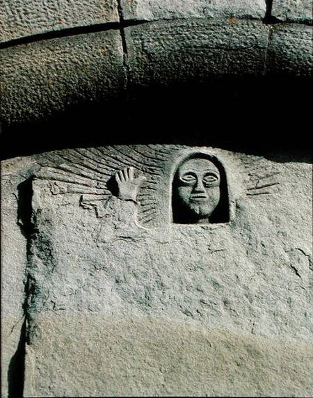 Relief depicting the head and face of a man, possibly God the Father, from the facade à École picturale italienne