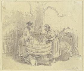 Zwei Wäscherinnen unter einem Baum an der Waschbütte, beide im Profil
