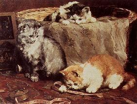 des jeunes chats jouent dans un panier de couture.