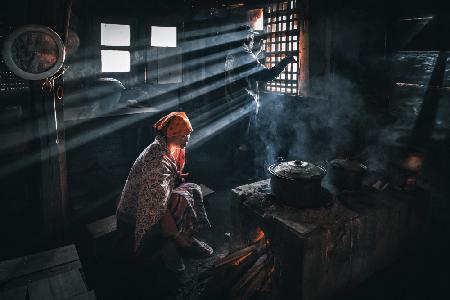 A village granny preparing a meal