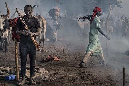 In a Mundari camp some use firearms while others use bows and arrows