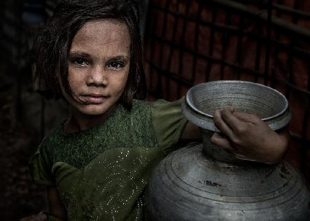 Rohingya refugee girl with a pitcher of water -Bangladesh