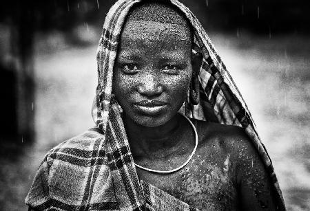 Surmi tribe girl on the rain - Ethiopia