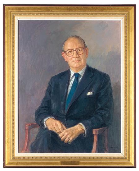 Portrait of Lord Aldington, seated wearing a dark suit