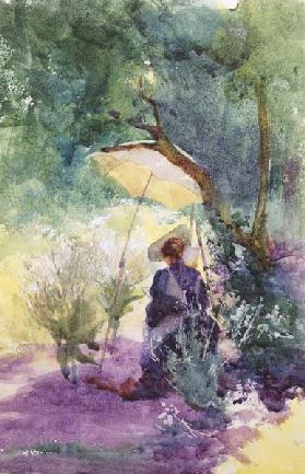 Eine Malerin im Schatten eines Sonnenschirms.