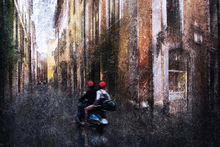 Tourists on a Vespa in the alleys of Rome