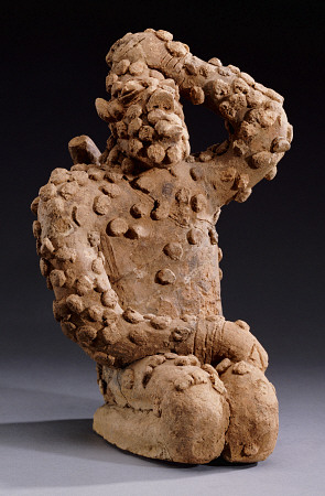 A Djenne Terracotta Kneeling Male Figure, 14th Century à 