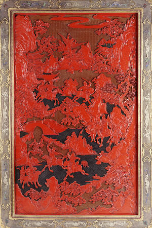A Filigree Framed Red Lacquer Panel Depicting Warriors On Horseback And Mythical Animals In A Landca à 