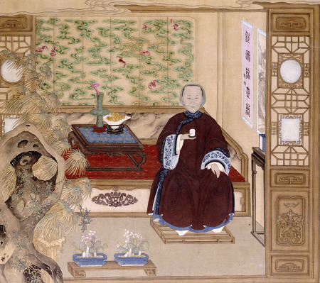 A Lady In Dark Red, Seated On A Day Bed Holding A Blue And White Cup à 