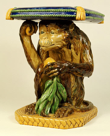 A Minton ''Majolica'' Garden Seat Modelled As A Crouching Monkey Supporting A Cushion On His Head, C à 