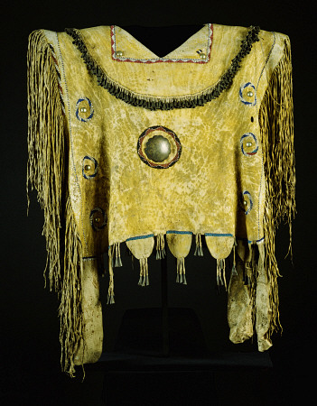 An Apache Beaded And Fringed Buckskin Poncho, Painted With Yelloe Ochre And Decorated With Tin Cones à 