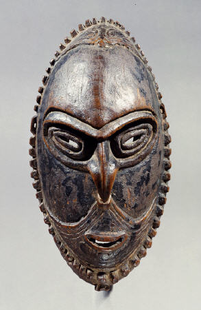 A New Guinea Mask Of Oval Form With Pierced Eyes, Mouth And Septum à 