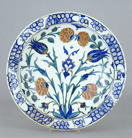 An Iznik Pottery Dish With Tulip And Peony Design, C à 