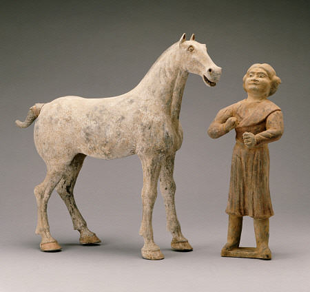 A Painted Grey Pottery Group Of A Horse And Groom à 