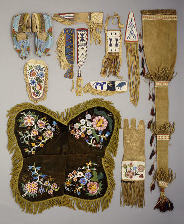 A Selection Of Native American Artefacts Including A Pair Of Sioux Beaded Moccasins And Skin Mirror à 
