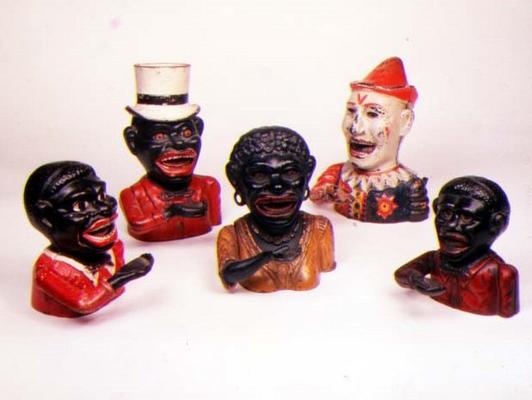 Group of Mechanical cast iron money banks. Left to right: Jolly Nigger with Butterfly Tie, Jolly Nig à 