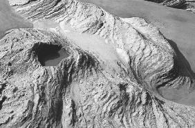 Rock on wet sand (b/w photo) 