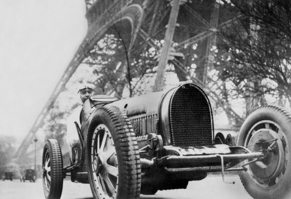 The French writer Paul Morand at the foot of the Eiffel Tower à 