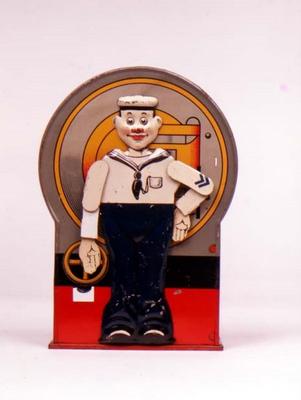 Tin Mechanical bank in form of a sailor. When the lever is depressed, he stands to attention and sal à 