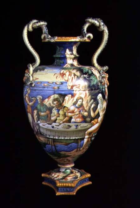 Maiolica urn with two handles in the shape of serpents, the body decorated with an al fresco banquet à Orazio Fontana of Urbino