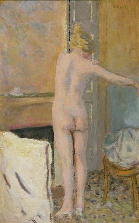 Nude in front of a Mantelpiece