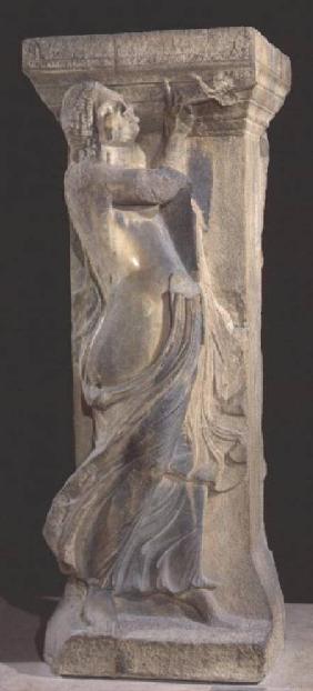Decorated stone pillar with a bacchante playing a double flute