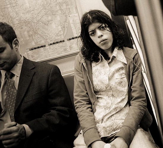Woman sitting on a subway and staring, 2004 (b/w photo)  à Stephen  Spiller