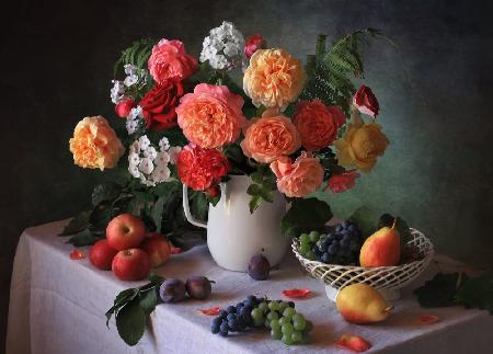 Still life with a bouquet and autumn fruits