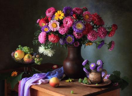 Still life with a bouquet of asters and fruits