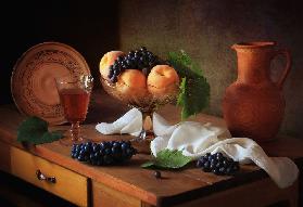 Still life with peaches and grapes