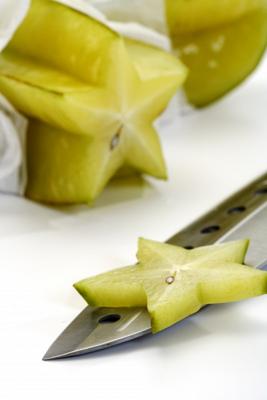 Die Sternfrucht mit Messer à Thomas Haupt